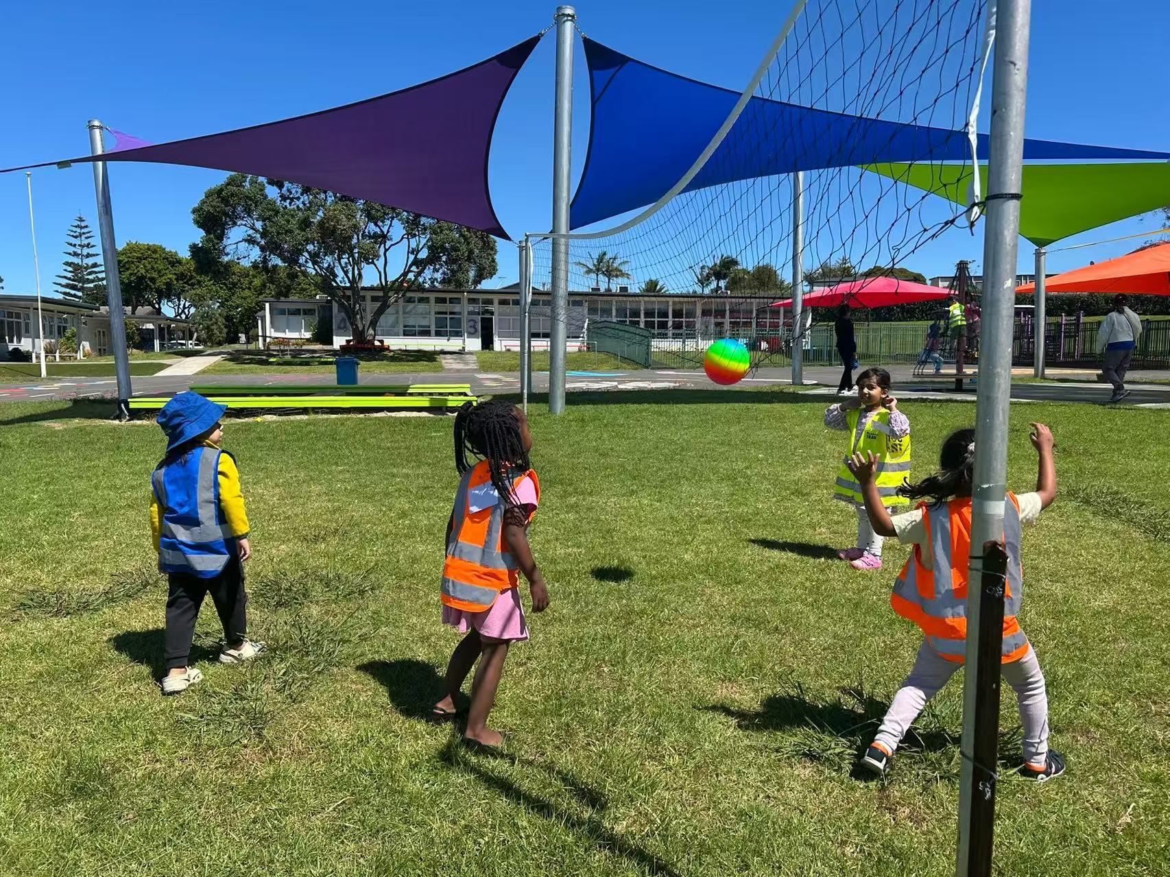 Children playing ball games outdoors during school transition