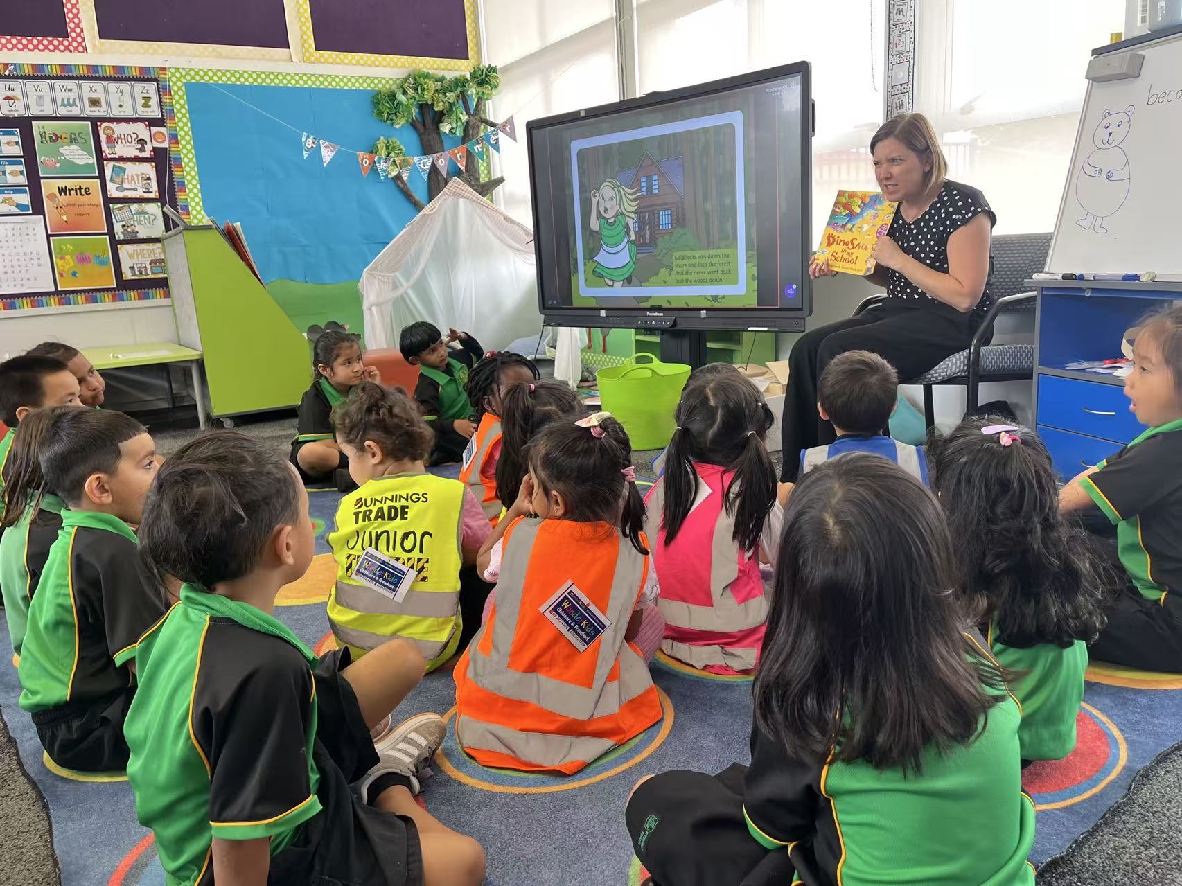 Children joining a story session in a school classroom