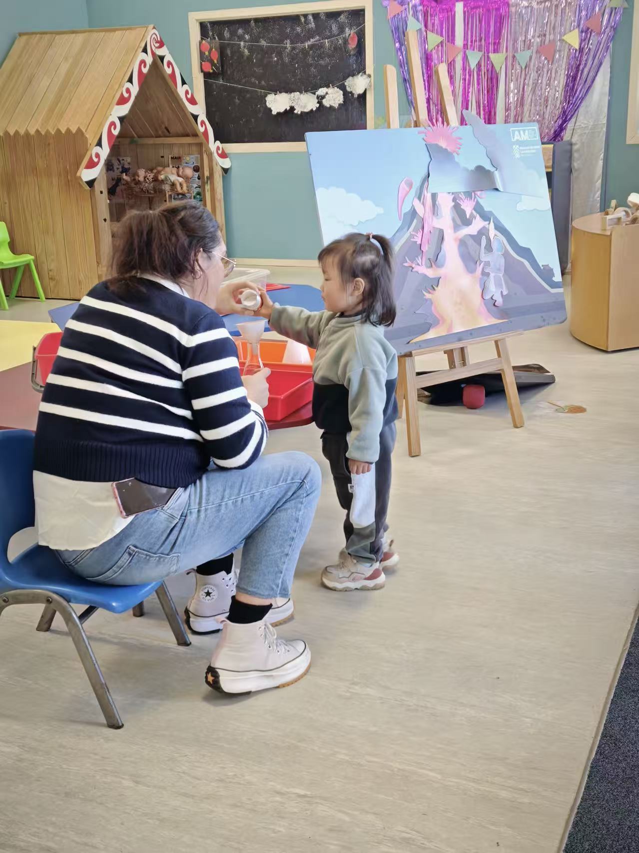 Child exploring the Volcano Van activity